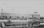 MPA155 Pond view cottages with butchers shop and slaughter house on the right of the picture 
